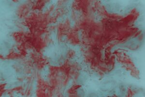 Abstract red and white marbled texture.