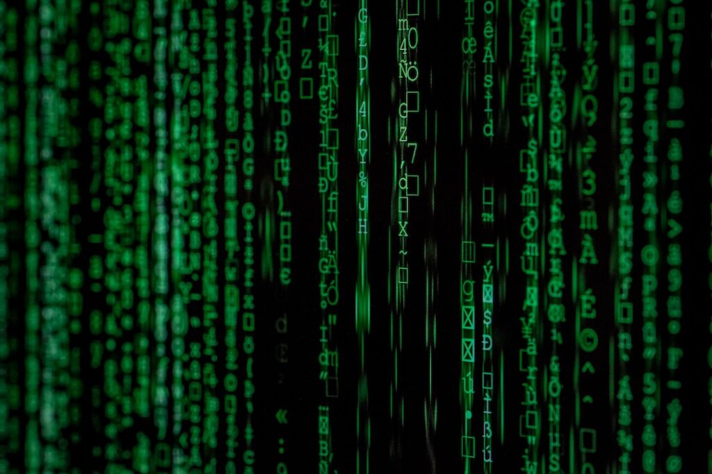 Green digital binary code data stream background.