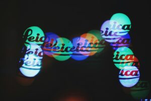 Colorful light bokeh effect with text overlay.