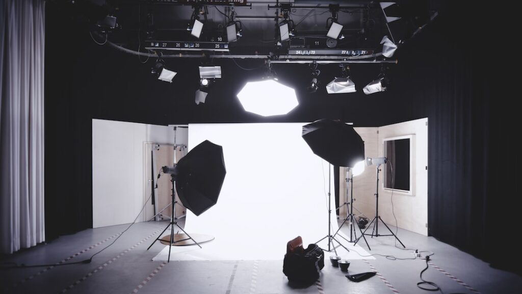 Professional photo studio with lighting equipment setup.