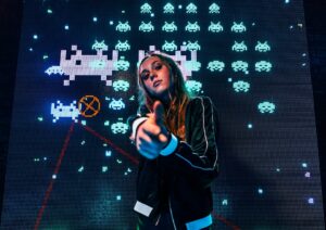 Person with retro video game screen background.