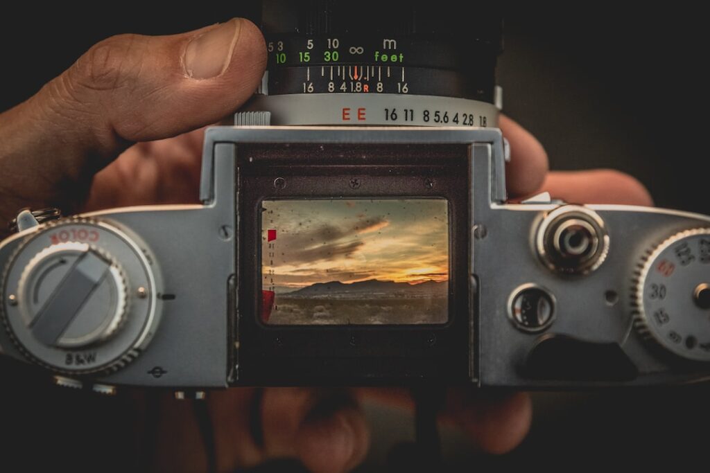 Sunset through vintage camera viewfinder.