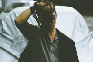 Photographer taking picture with DSLR camera