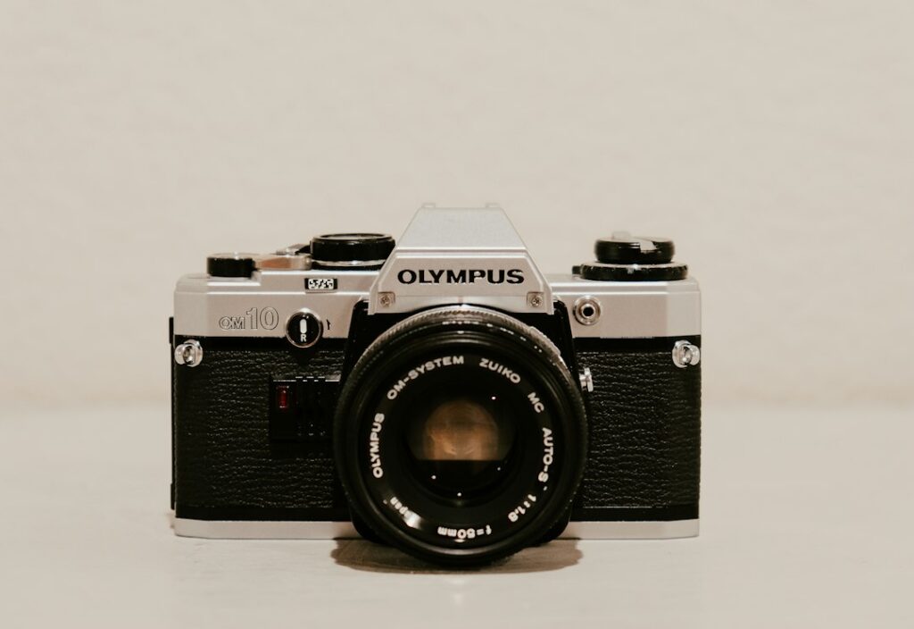 Vintage Olympus OM-10 film camera on display.