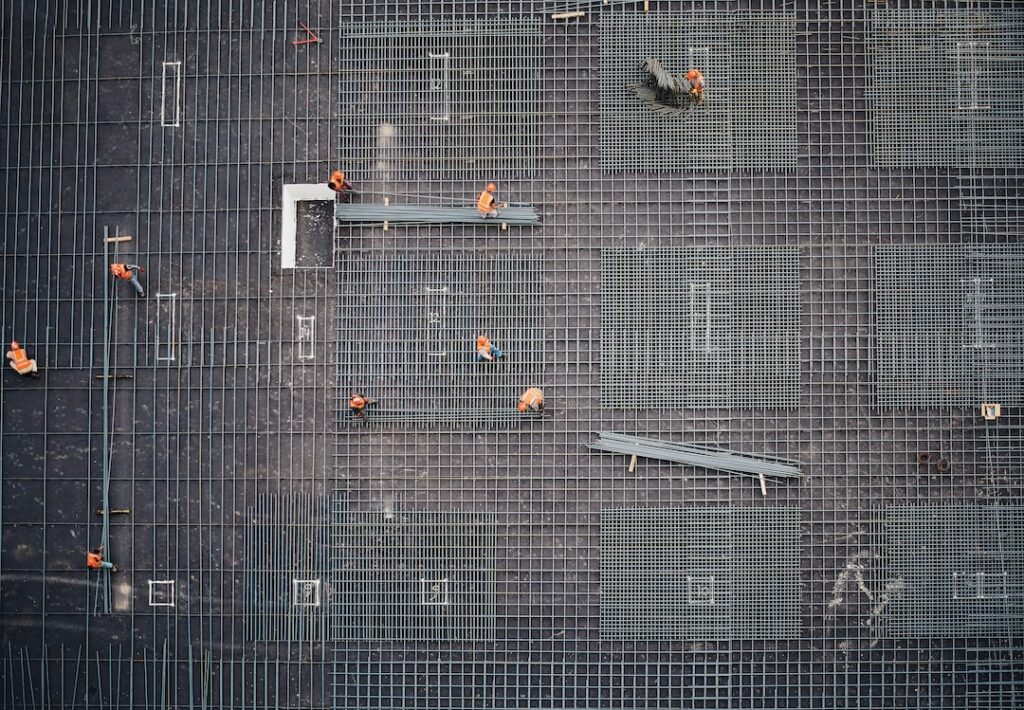 Aerial view of construction workers on site.