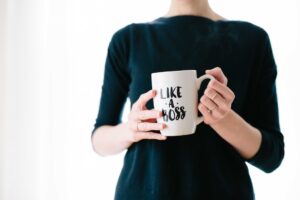 Person holding mug with "Like a Boss" text.