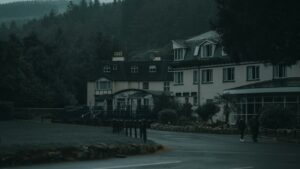 Secluded hotel in forested area during overcast day.