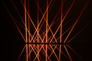 Abstract red light patterns on dark background.