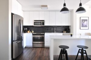 Modern kitchen interior with stainless steel appliances.