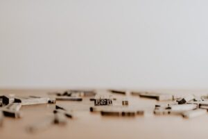 Scattered wooden letters with focus on 'Learn'.